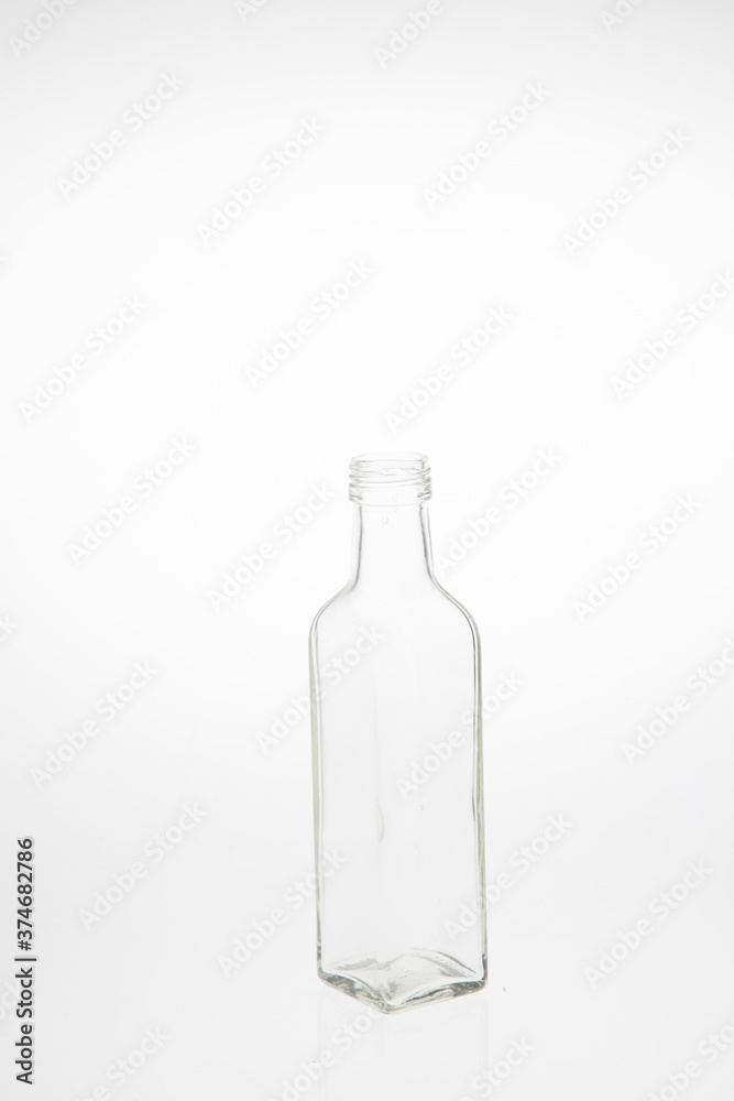 Isolated glass bottle on white background without cap. Isolated glass bottle on white background without cap.