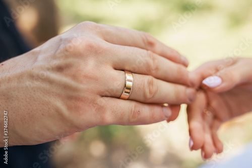 Wedding couple exchanging wedding rings. Wedding rings. © Карина Товарницкая