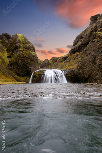 Fototapeta Naklejka Na Ścianę i Meble -  Colorful sunset at a waterfall in Iceland
