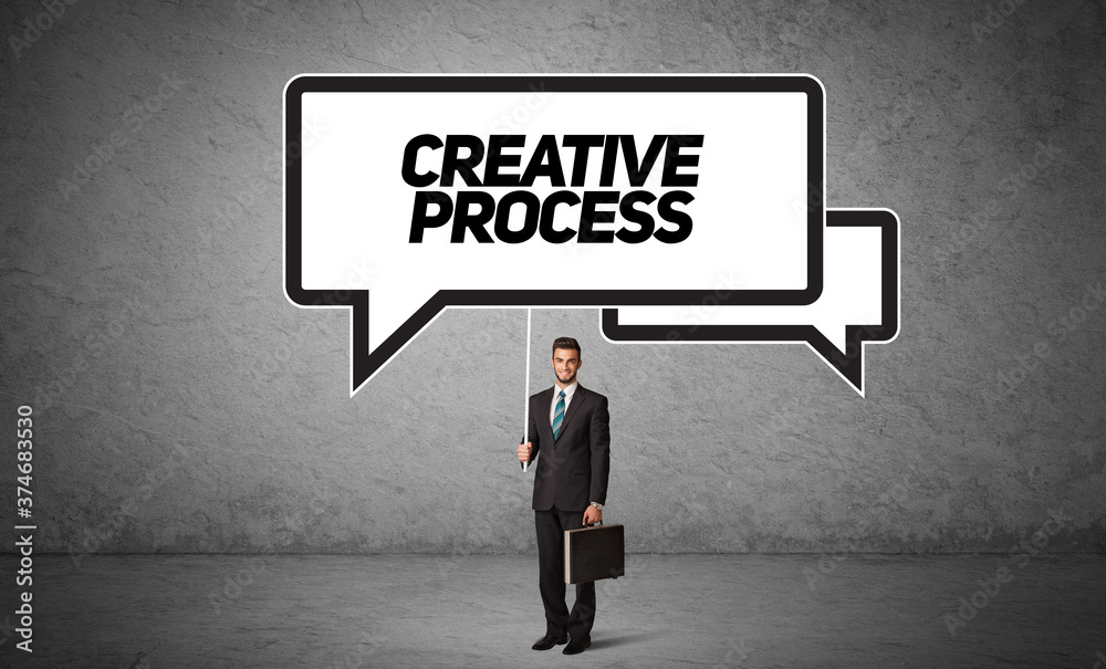 Young business person in casual holding road sign with CREATIVE PROCESS inscription, new business idea concept Young business person in casual holding road sign with CREATIVE PROCESS inscription, new business idea concept