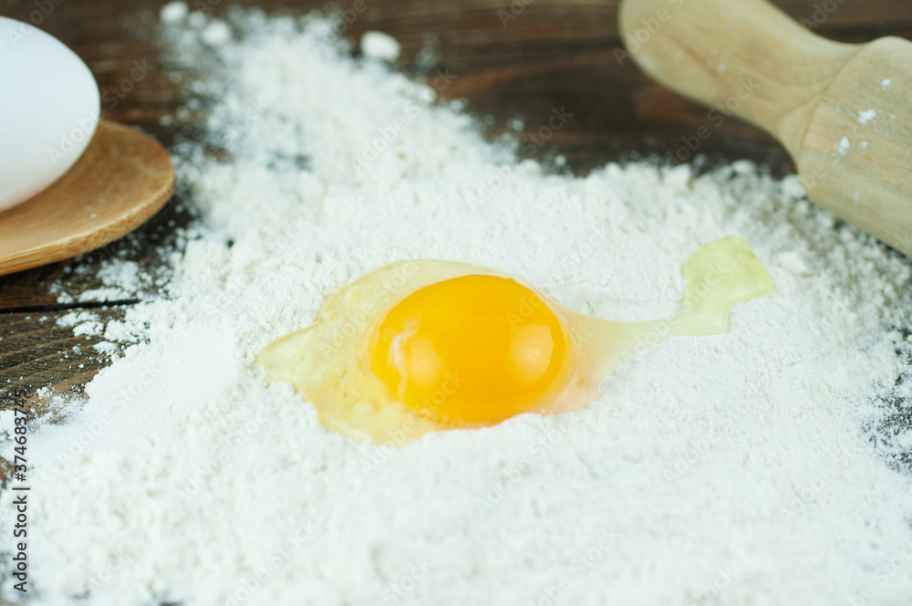 chicken eggs and flour on a wooden background, the concept of making dough chicken eggs and flour on a wooden background, the concept of making dough
