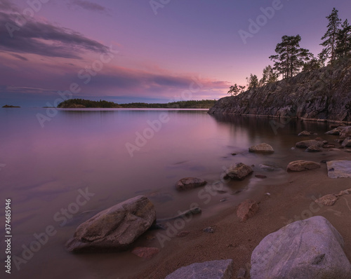 National Park Ladoga Skerries in the North of Russia in the Republic of Karelia. Long exposure on a summer evening at sunset photo