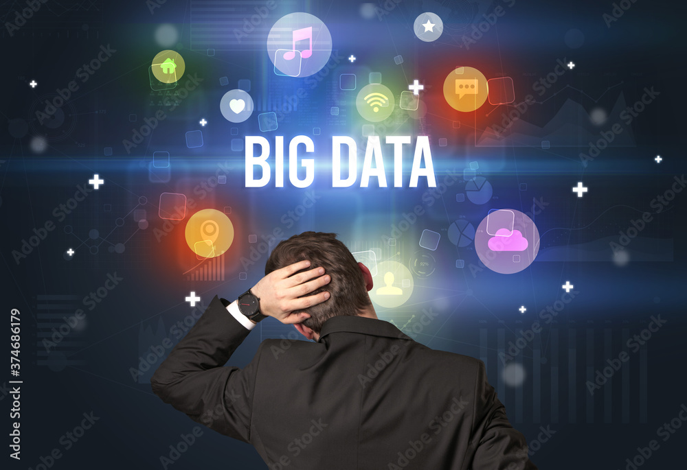 Rear view of a businessman with BIG DATA inscription, modern technology concept Rear view of a businessman with BIG DATA inscription, modern technology concept