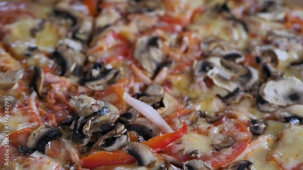 Tracking shot of delicious pizza pieces