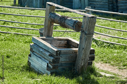 old ruined village well made of wood