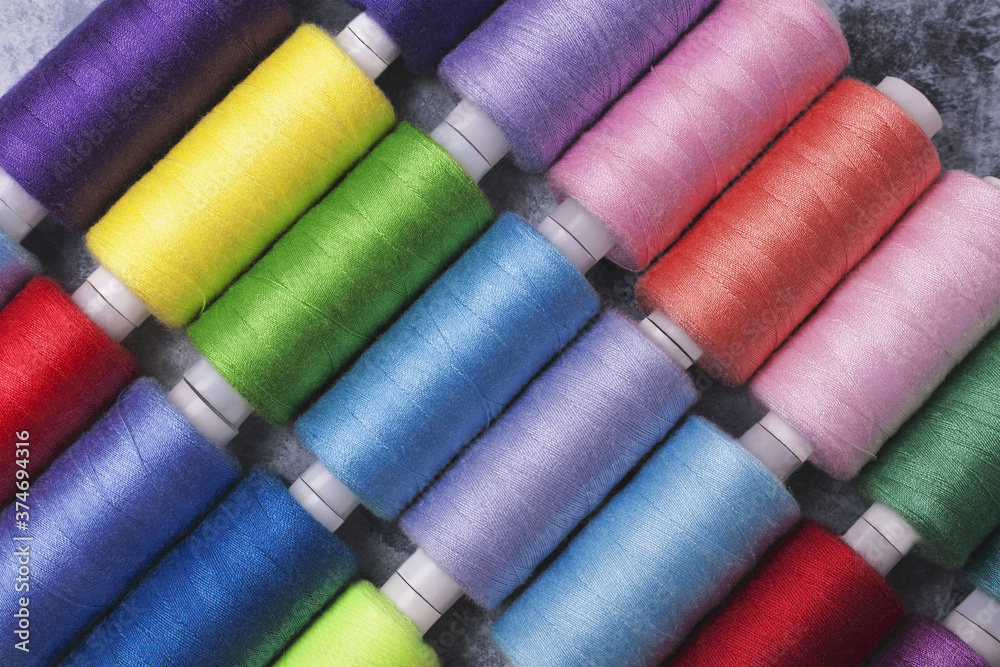 Colored threads on bobbins blue, green ,red. Colored threads on bobbins blue, green ,red.