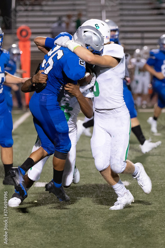 Great action photos of football players making amazing plays during a football game