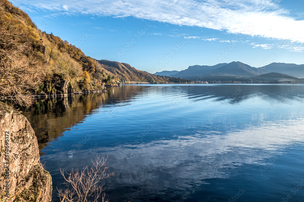 Foliage in the coast of the Lake Maggiore with reflections on the water