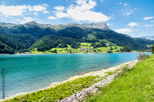 Fototapeta Naklejka Na Ścianę i Meble -  Beautiful view to Lago di Resia, Lake Reschen, Alto Adige, South Tyrol, Italy