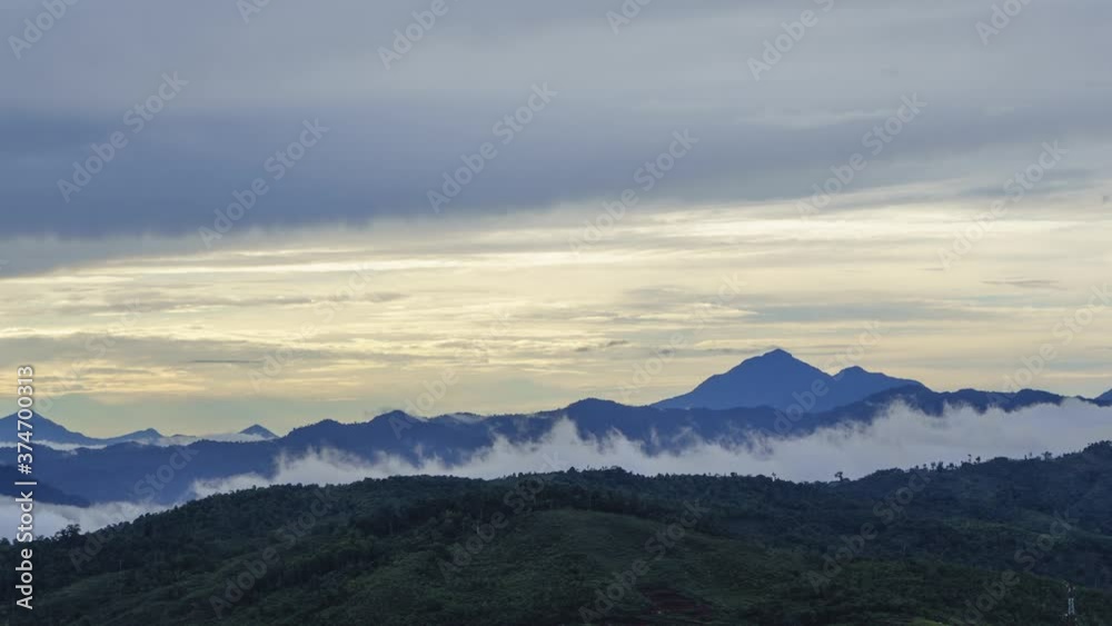 Beautiful View Of Fast Rolling Clouds Drifting Over village. Soft Focus. TAKEN AT RANAU PARAGLIDING PARK, SABAH , BORNEO. Beautiful View Of Fast Rolling Clouds Drifting Over village. Soft Focus. TAKEN AT RANAU PARAGLIDING PARK, SABAH , BORNEO.
