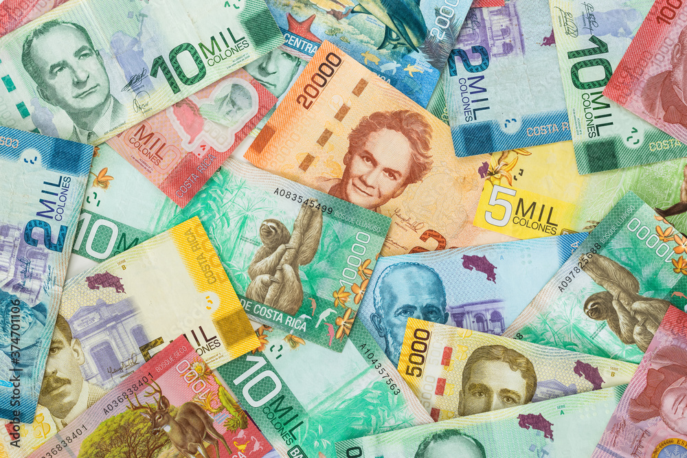 Money from Costa Rica. All denominations, paper banknotes, scattered on the table Money from Costa Rica. All denominations, paper banknotes, scattered on the table