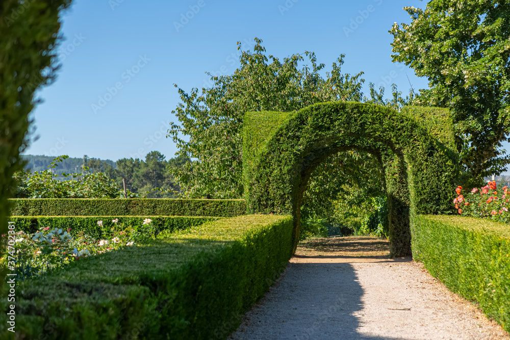 View of a pedestrian path on iconic and geometric classic baroque garden, located inside the Villa de Mateus in Vila Real View of a pedestrian path on iconic and geometric classic baroque garden, located inside the Villa de Mateus in Vila Real