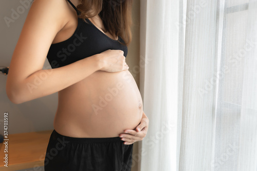 Portrait of asian pregnant woman in the bedroom Free Download Portrait of asian pregnant woman in the bedroom - GFXLoad