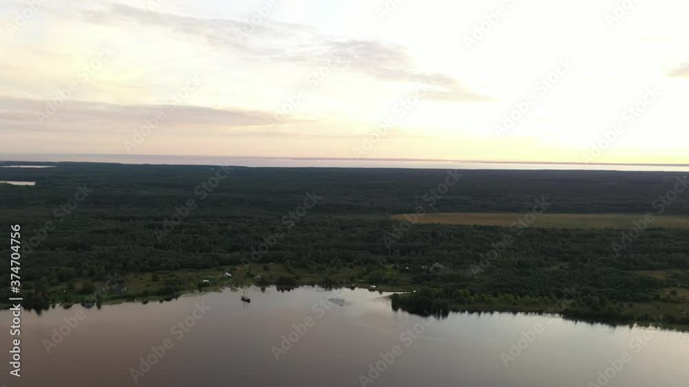 a panoramic view of the green islands on the lake with ships with ancient architectural buildings filmed from a drone a panoramic view of the green islands on the lake with ships with ancient architectural buildings filmed from a drone