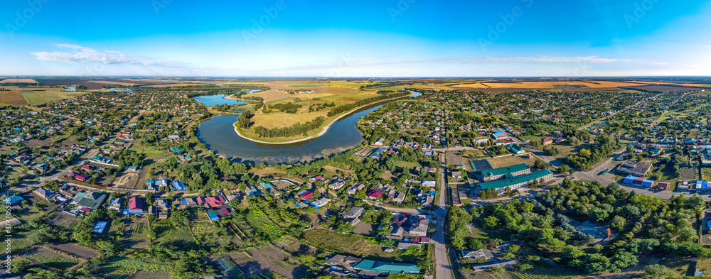 aerial panorama of the coast of the village of Sergievskaya (South of Russia) and the bend of the Kirpili river on a sunny summer day