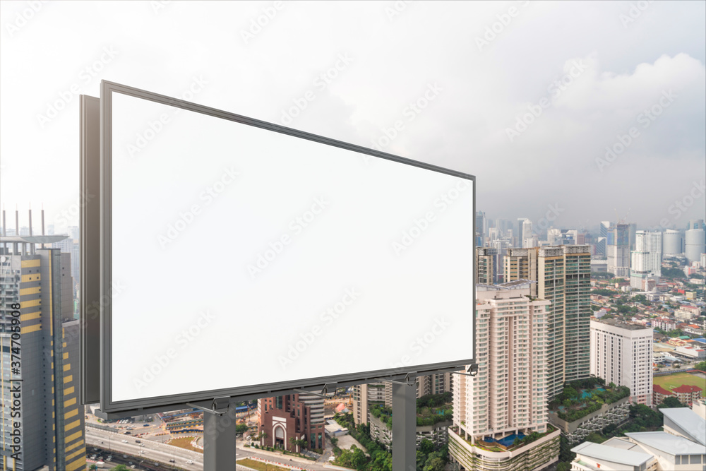 Blank white road billboard with KL cityscape background at day time. Street advertising poster, mock up, 3D rendering. Side view. The concept of marketing communication to promote or sell idea. Blank white road billboard with KL cityscape background at day time. Street advertising poster, mock up, 3D rendering. Side view. The concept of marketing communication to promote or sell idea.