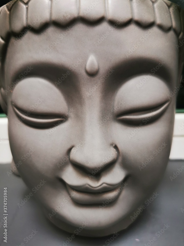 buddha head isolated on black