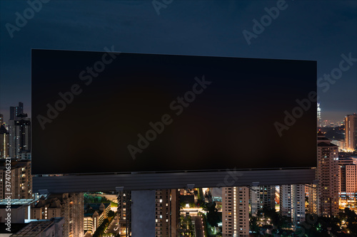 Photography Blank black road billboard with Kuala Lumpur cityscape background at night time
