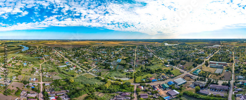 aerial panorama of the village of Sergievskaya (South of Russia) and the bend of the Kirpili river on a sunny summer day photo