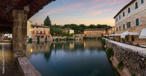 Thermal bath town of Bagno Vignoni, Italy during sunrise photo