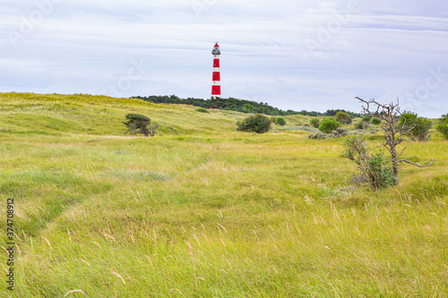 Lighthouse in a rural landscape on an island in the North Sea, Ameland, Holland