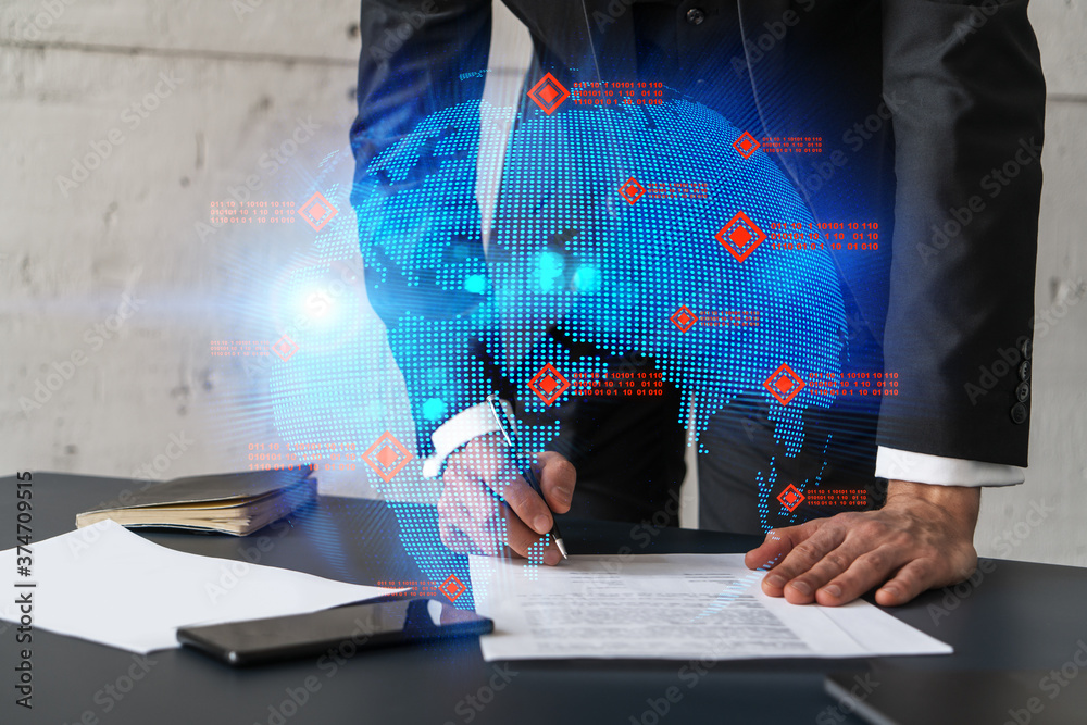 Businessman in suit signs contract. Double exposure with world map hologram. Man signing agreement international business concept. Businessman in suit signs contract. Double exposure with world map hologram. Man signing agreement international business concept.