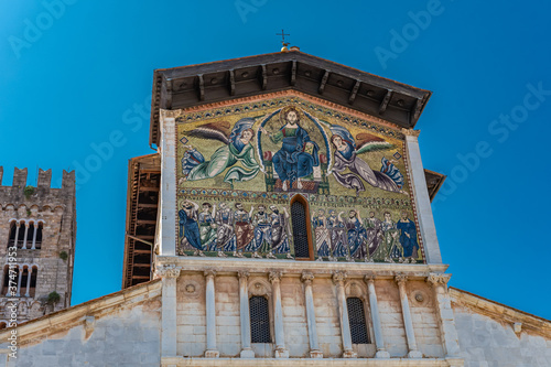 fresco on the facade of a church in Italy photo