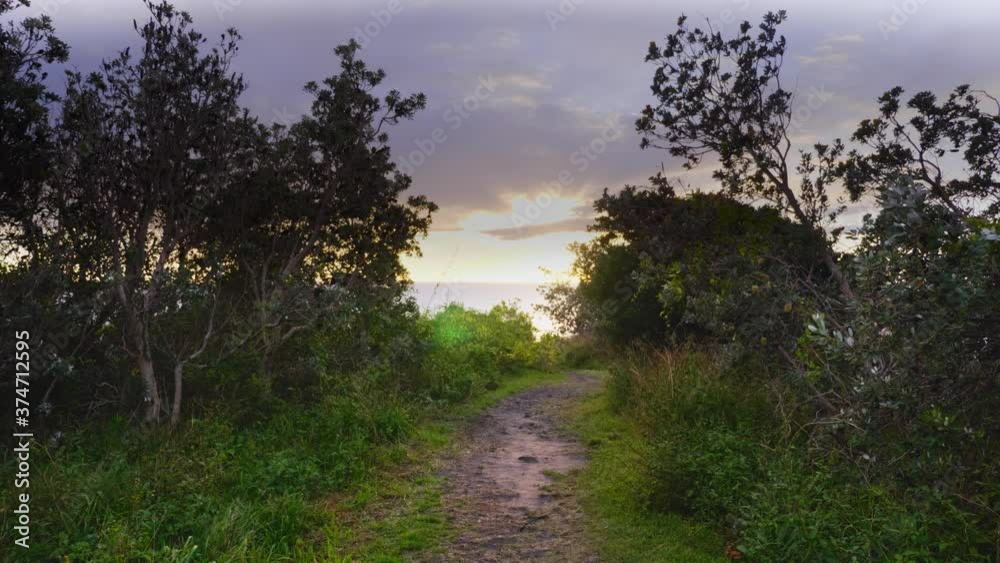 Mountain Trail Overlooking The Beautiful Sunrise And Ocean - Crescent Head Beach - Sydney, NSW, Australia. - wide static shot Mountain Trail Overlooking The Beautiful Sunrise And Ocean - Crescent Head Beach - Sydney, NSW, Australia. - wide static shot