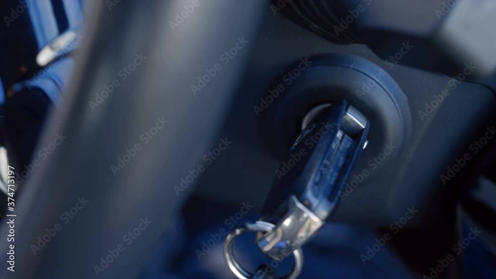 Added shaking from moving the car! The driver inserts the ignition key into the ignition lock, turns it and starts the engine, then turns off the engine and removes the key. Closeup