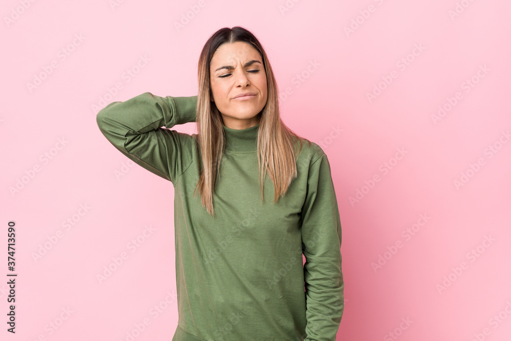 Young caucasian woman isolated suffering neck pain due to sedentary lifestyle. Young caucasian woman isolated suffering neck pain due to sedentary lifestyle.