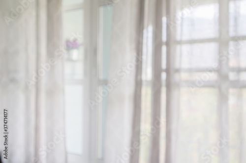window curtain with green garden abstract blur background