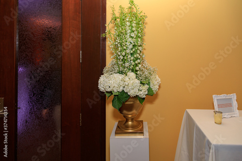 Beautiful floral arrangement white and green with gold planter 