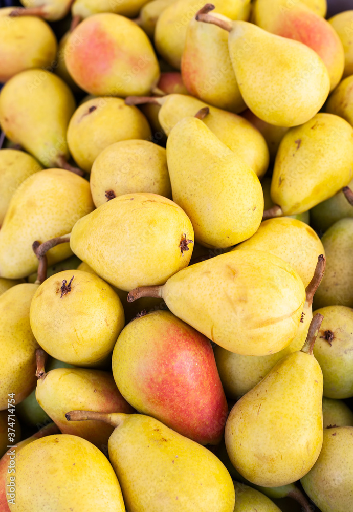 Detail of some delicious bulk pears in a street market.