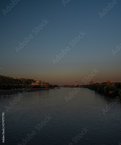 Bratislava capital in summer evening with color sunset and river Donau