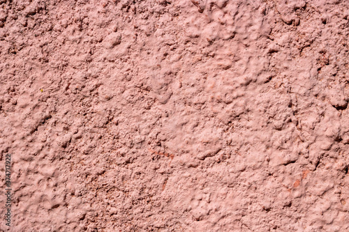Terracotta plaster on the wall. Background texture.abstract surface