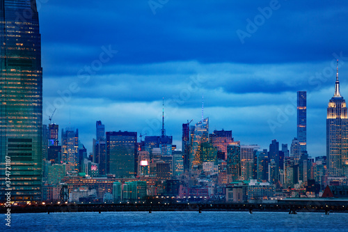 View of New York middle Manhattan downtown over Hudson river on moody overcast evening
