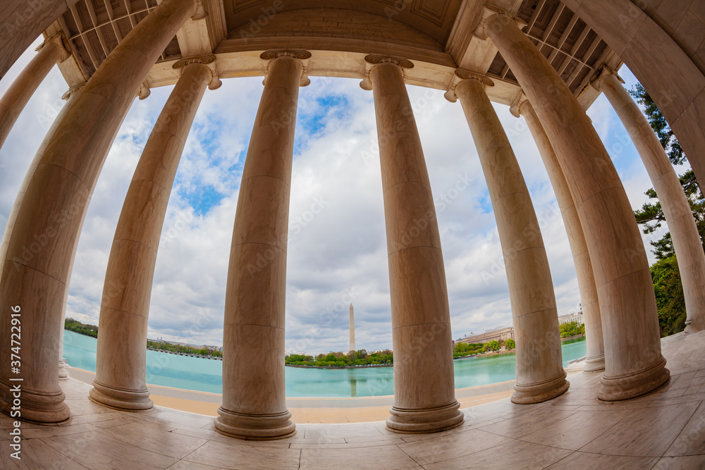 Fototapeta premium United States: Thomas Jefferson Memorial columns and interior over Washington monument column