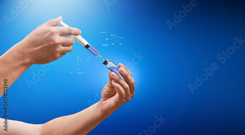 Fototapeta Naklejka Na Ścianę i Meble -  Doctor hand extracting medical drug with molecule code floating around. Deep blue background. Medical concept for health care, reseach, and science.