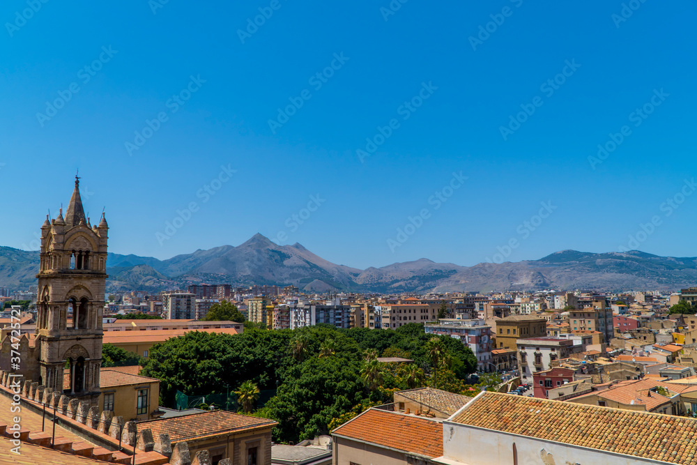 Aerial panoramic view of Palermo, Sicily, Italy from Palermo Cathedral with the tower and mountains in the background