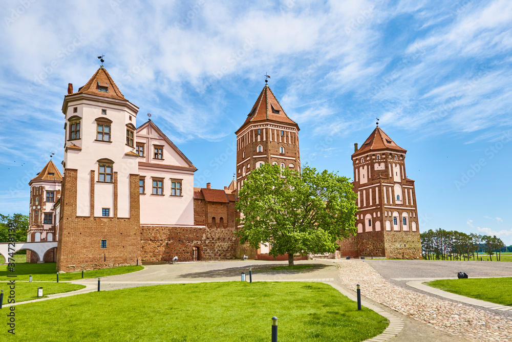 Mir castle complex in summer day with blue cloudy sky. Tourism landmark in Belarus, cultural monument