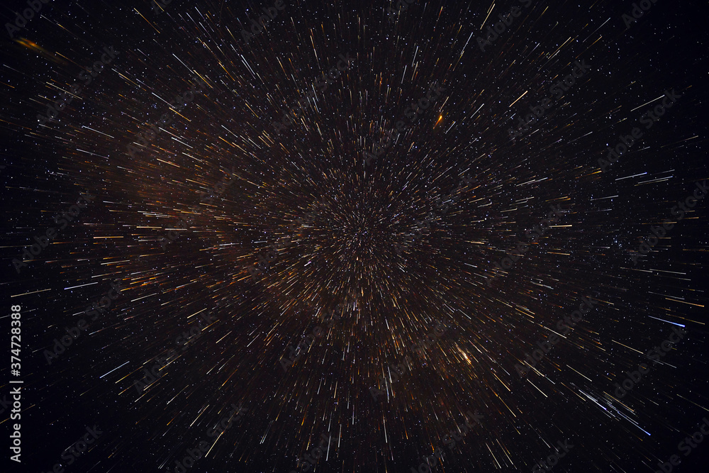 Fototapeta premium Meteor shower against the background of the black night sky and stars.