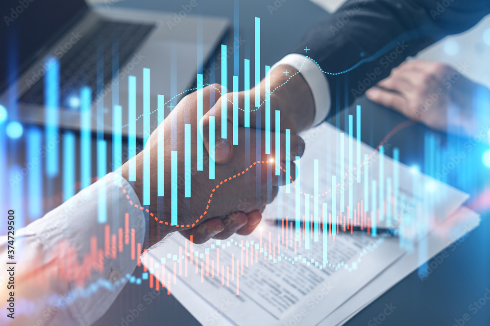 Multiexposure of two businesspeople handshake and forex graph hologram drawing background. Concept of financial market. Formal wear.