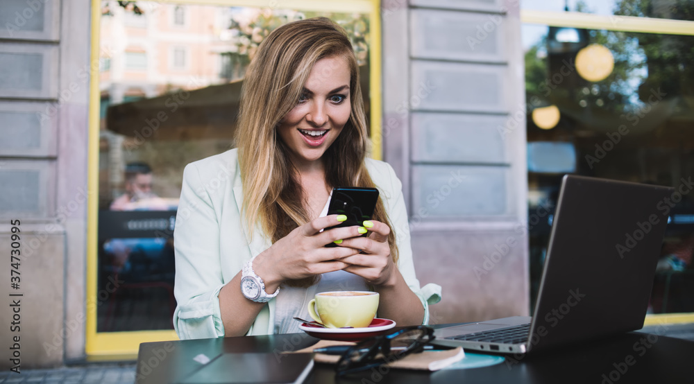 Excited businesswoman chatting on smartphone Excited businesswoman chatting on smartphone