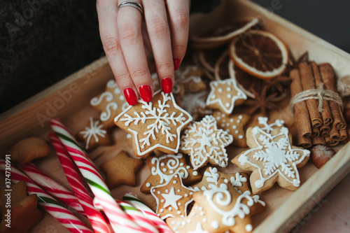 Woman eating festive gingerbread sweets