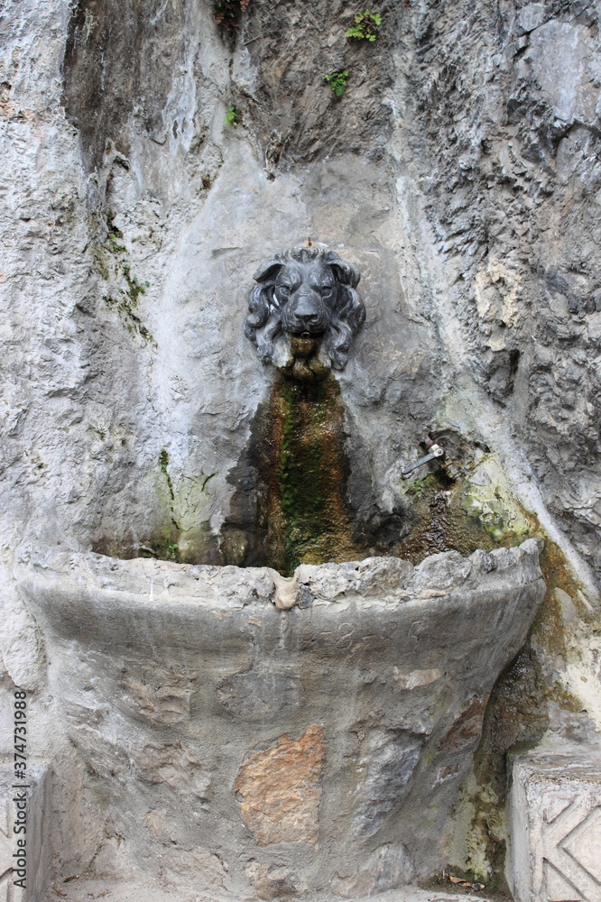 Ancient fountain with lion