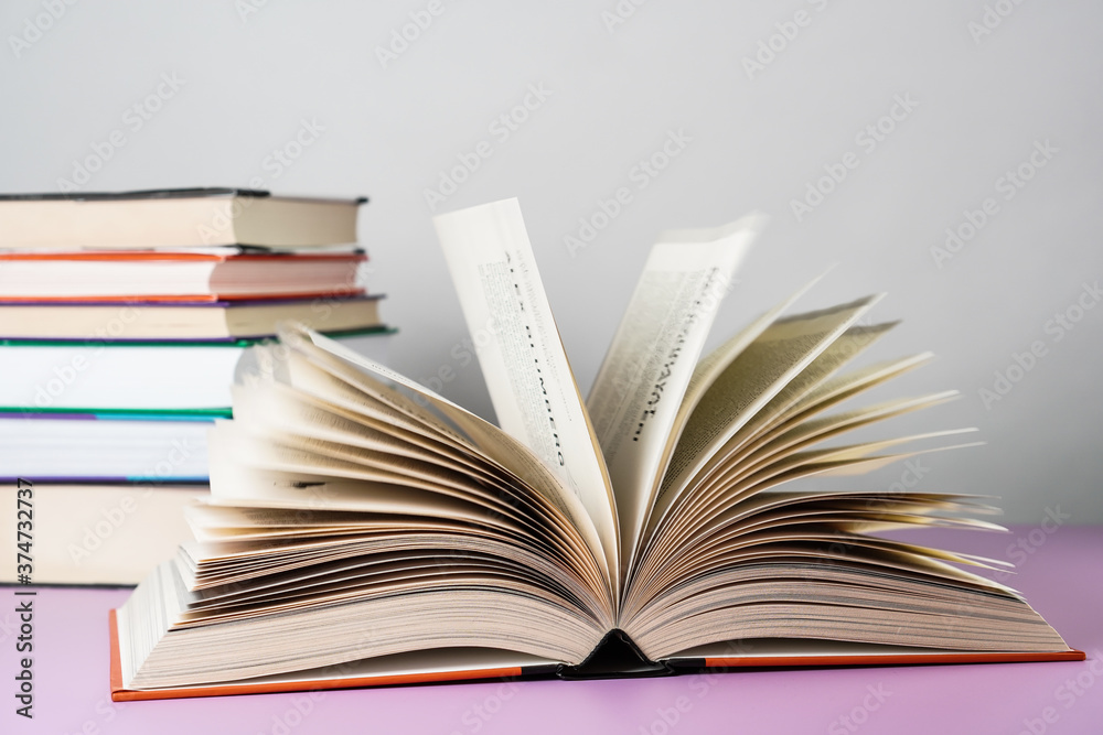 Close-up of open book on the table. Close-up of open book on the table.