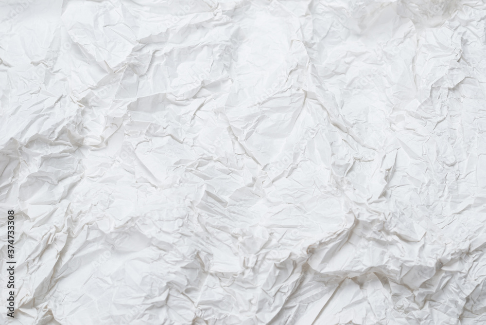 Obraz premium Crumpled white paper background.