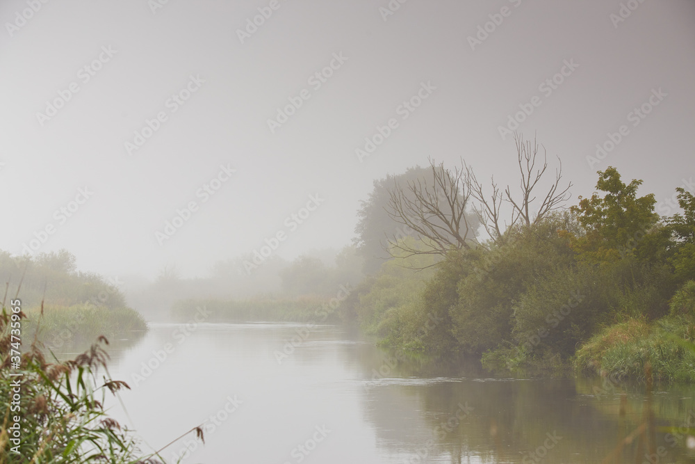 Haze and mist over water. Fog over river