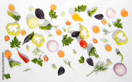 Composition of vegetables cut for salad on a white background. Background with food.