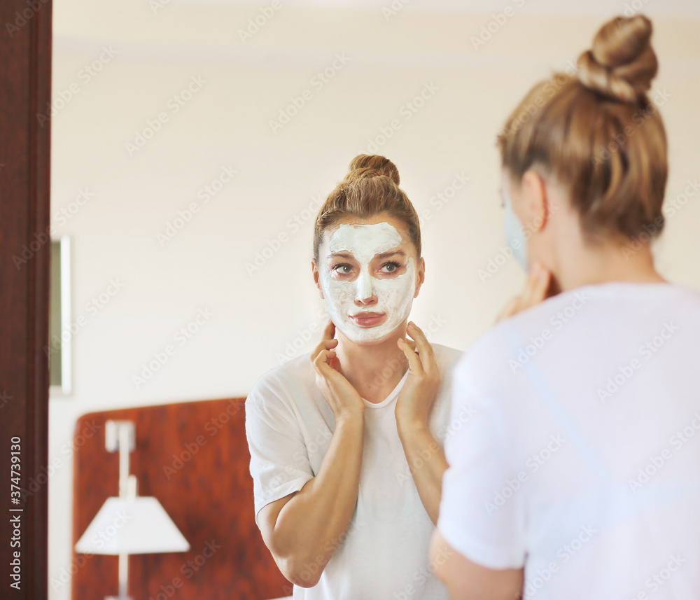 Anti-aging therapy. young woman applying facial mask. woman moisturizing face mask. Cosmetology and skin care concept. Anti-aging therapy. young woman applying facial mask. woman moisturizing face mask. Cosmetology and skin care concept.
